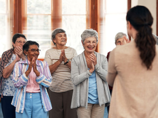 Seniors smiling and clapping