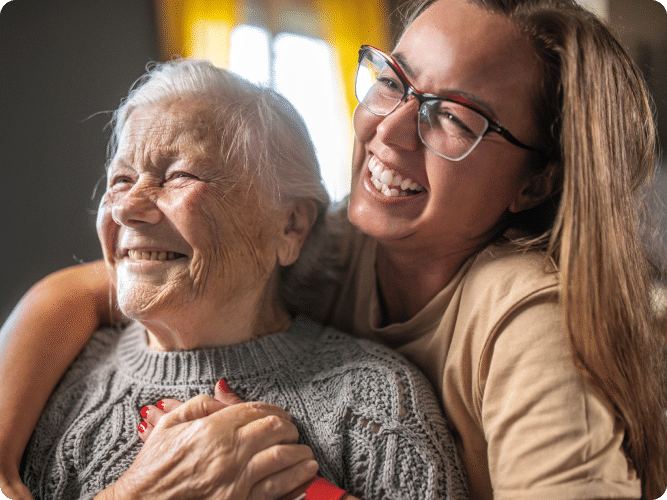 Senior woman and daughter hugging