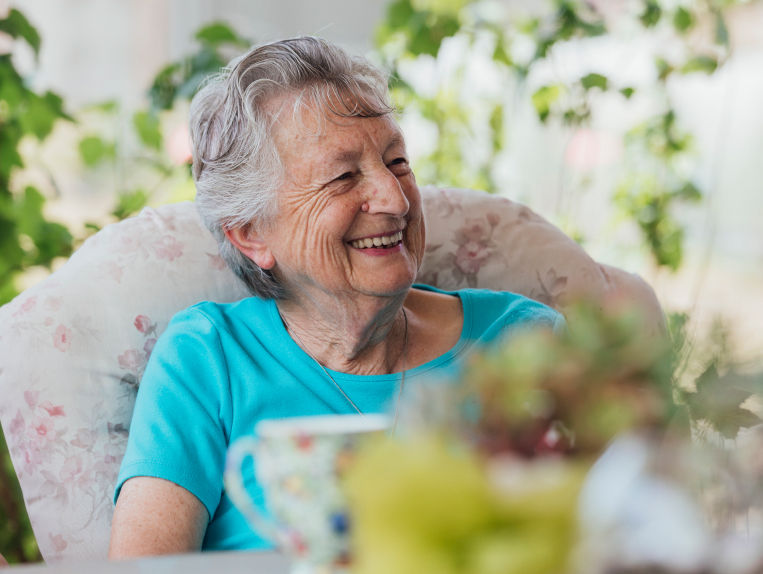 Senior woman sitting in chair