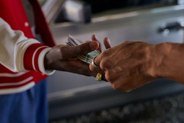 handing over money