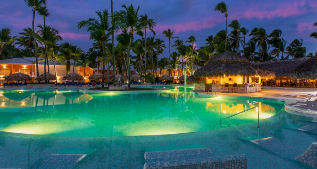 Main illuminated pool at night at the Grand Palladium Palace Resort Spa & Casino in Punta Cana