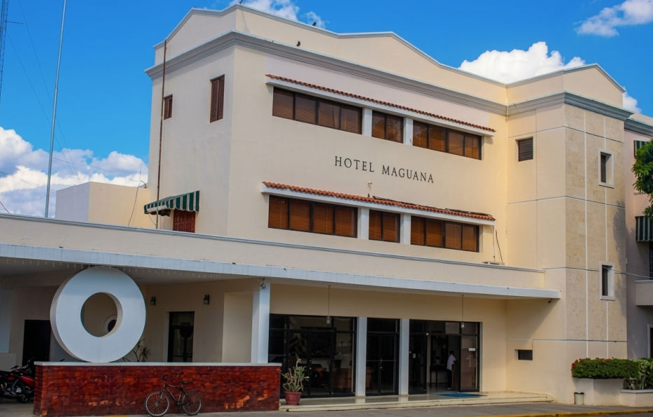 Exterior facade and main entrance of Hotel Maguana in San Juan de la Maguana, Dominican Republic.