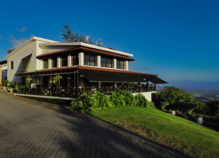 Main facade and exclusive entrance of the Camp David Ranch mountain hotel in Santiago de los Caballeros, Dominican Republic.