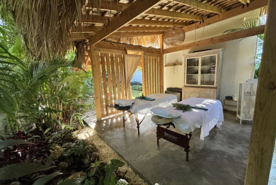 Takuma Boutik Hotel reception surrounded by tropical vegetation