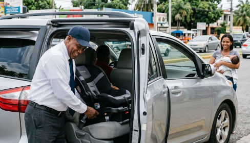 Taxi Dominicana driver trained in the proper installation of child car safety seats
