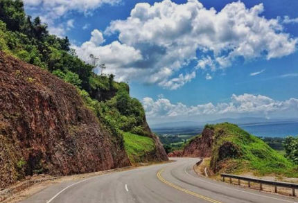 Highway and lush green vegetation on the Miches to Punta Cana route