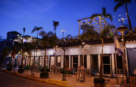 Exterior facade and tropical swimming pool at Batey Hotel Boutique in Boca Chica