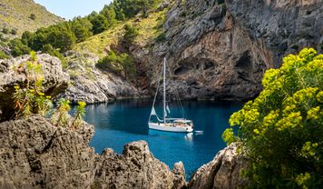 Sailboat in secluded bay in Mallorca
