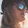 Close up of woman with hat and sunglasses