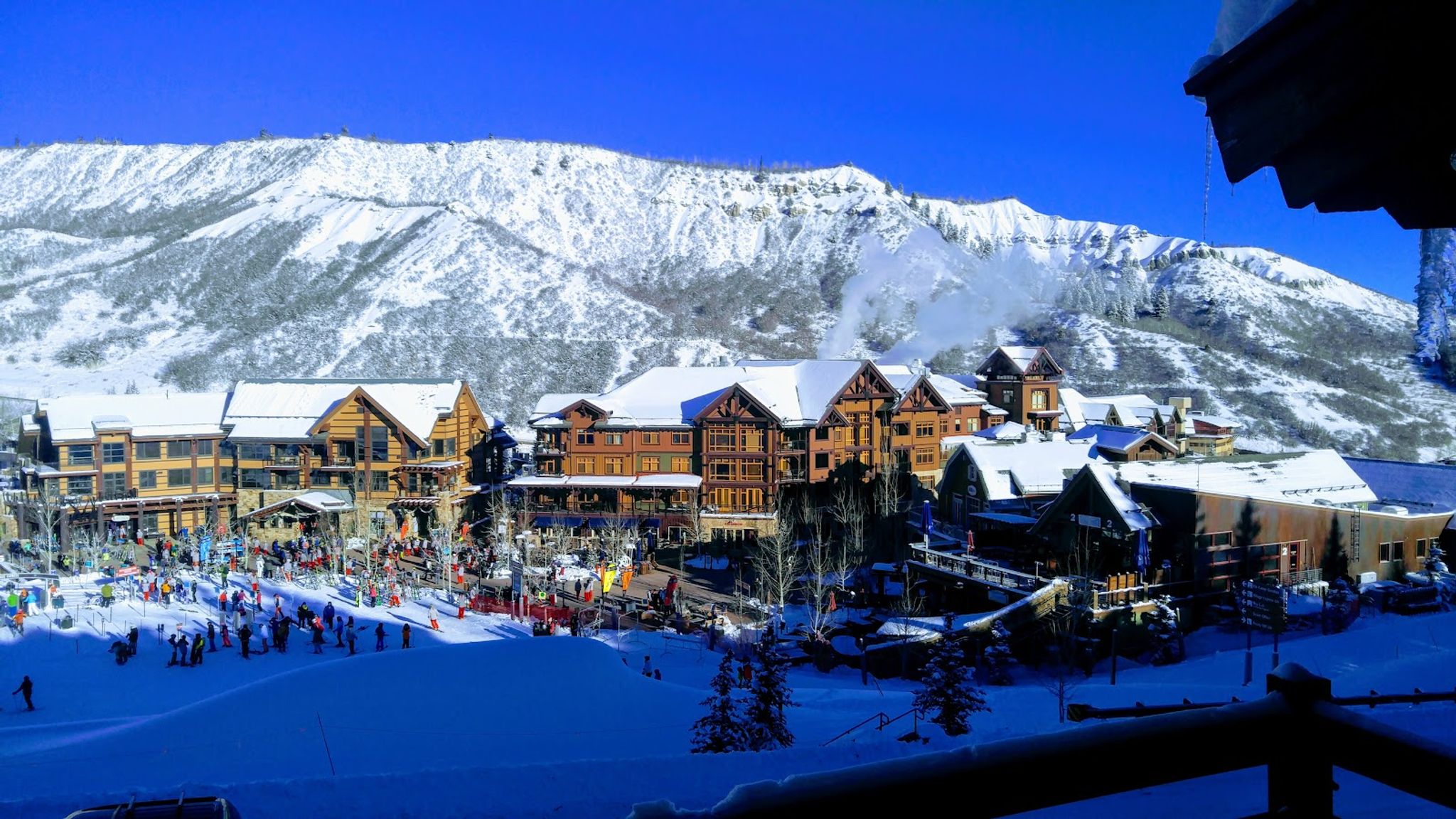 Snow-covered peaks above Aspen with historic Victorian town below