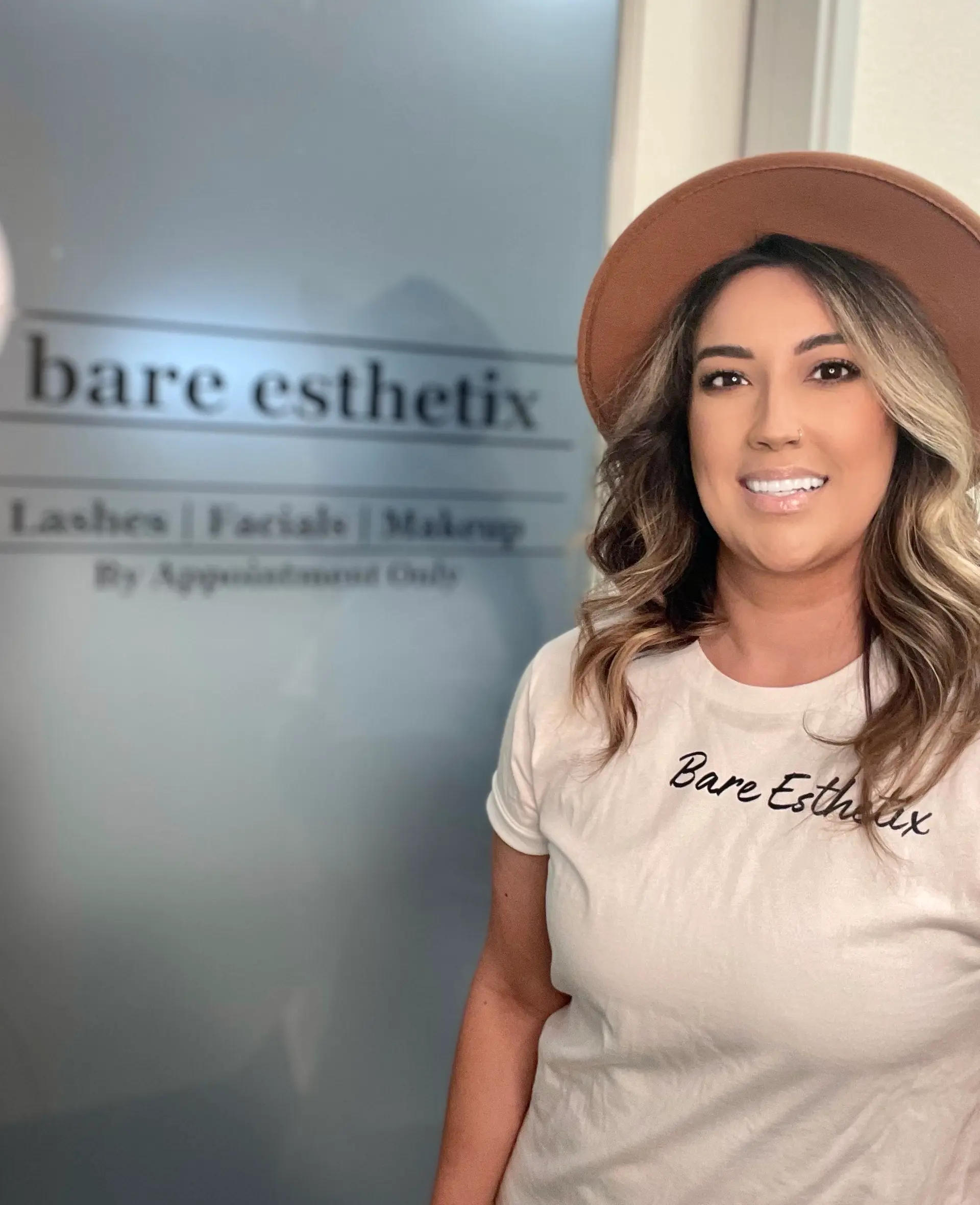 smiling,hat,branded shirt,glass door