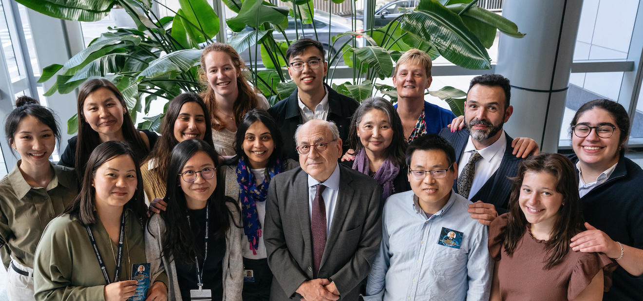 Stuart Orkin, Vijay Sankaran, and lab members gather for a group portrait.