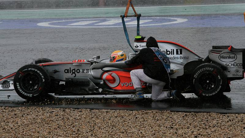 Lewis Hamilton rejoins the 2007 European Grand Prix at the Nurburgring after going off and being lifted out of the gravel by a crane