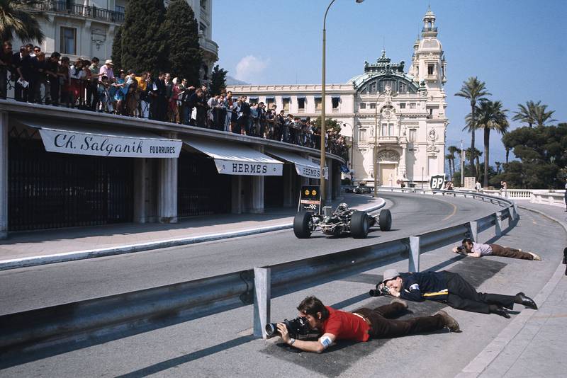 Photographers shoot from below the new barriers on the approach to Casino Square.