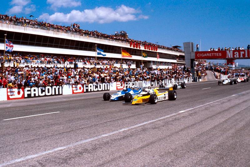 Rene Arnoux in a Renault RE20 leads Didier Pironi in his Ligier JS11/15 Ford and Carlos Reutemann in his Williams FW07B Ford at the start.