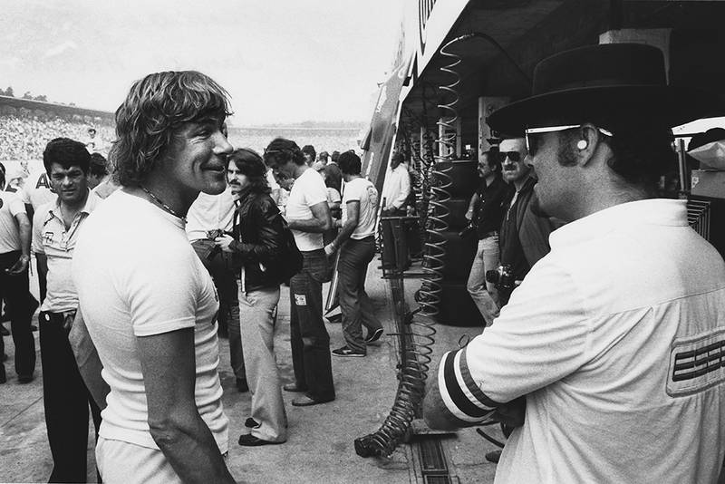 James Hunt shares a joke with a Lotus mechanic.