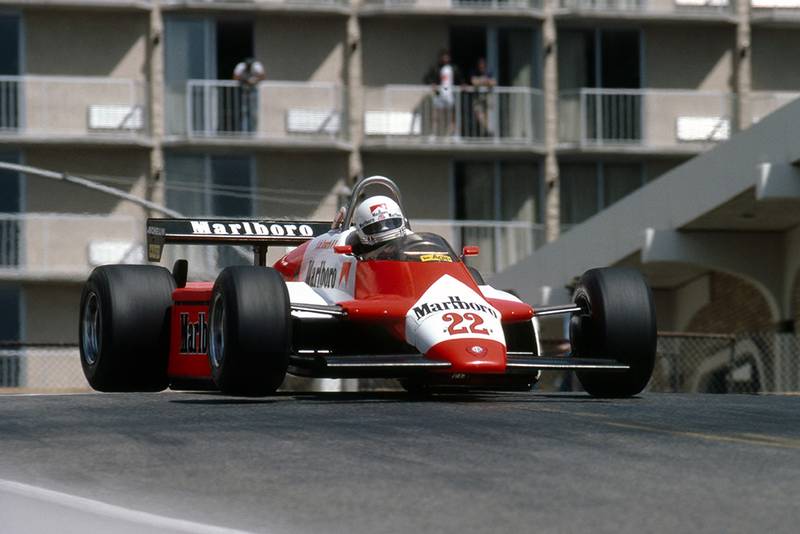Andrea de Cesaris gets big air in his Alfa Romeo 182.
