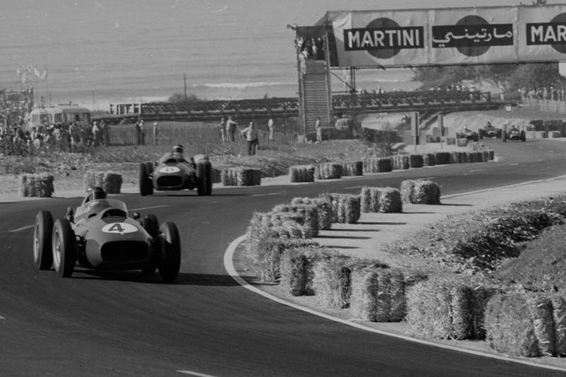 Phil Hill leads Mike Hawthorn in Ferrari Dino 246's.
