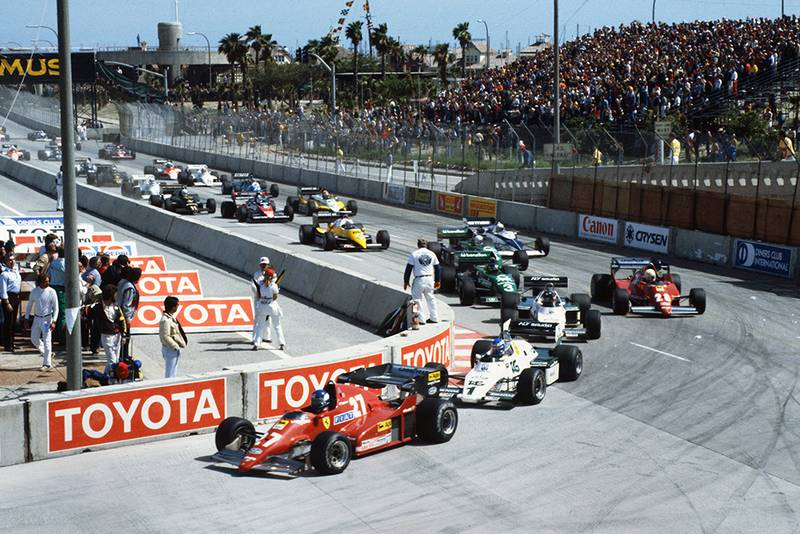 Patrick Tambay (Ferrari 126C2B), Keke Rosberg (Williams FW08C Ford), Jacques Laffite (Williams FW08C Ford), René Arnoux (Ferrari 126C2B), and Michele Alboreto (Tyrrell 011 Ford), lead at the start.