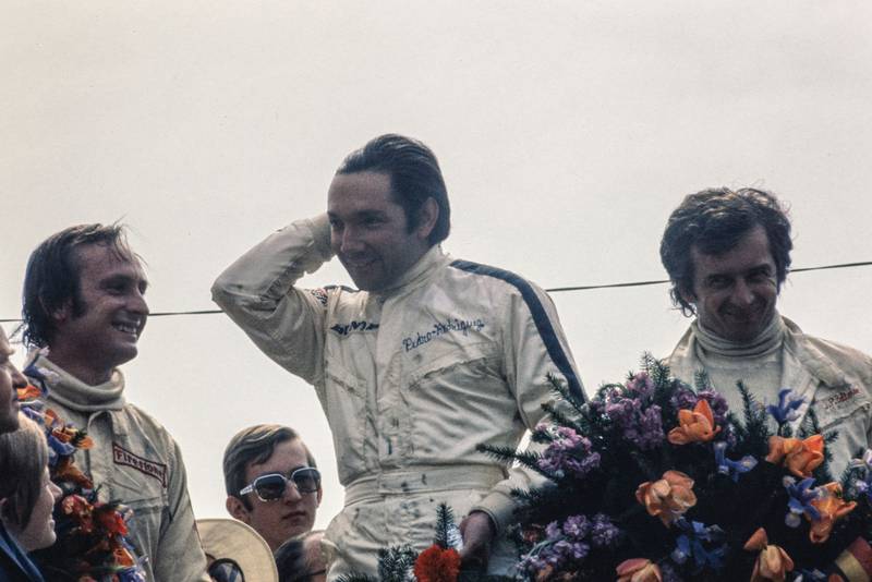 BRM's Pedro Rodriguez stands on the podium after winning the 1970 Belgian Grand Prix.