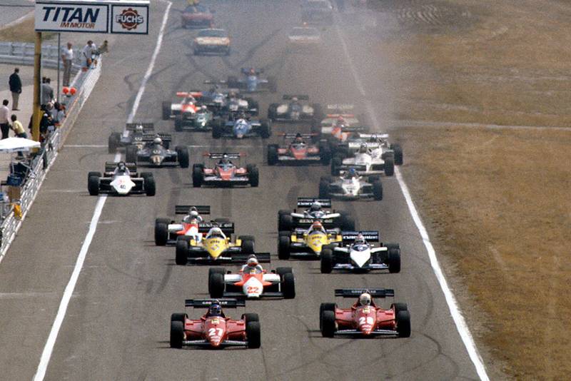 Patrick Tambay and Rene Arnoux (both Ferrari 126C3's) lead Andrea de Cesaris (Alfa Romeo 183T) and Nelson Piquet (Brabham BT52B BMW), Alain Prost and Eddie Cheever (both Renault RE40's) at the start.
