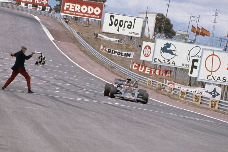 Emerson Fittipaldi takes the chequered flag to win the 1972 Spanish Grand Prix