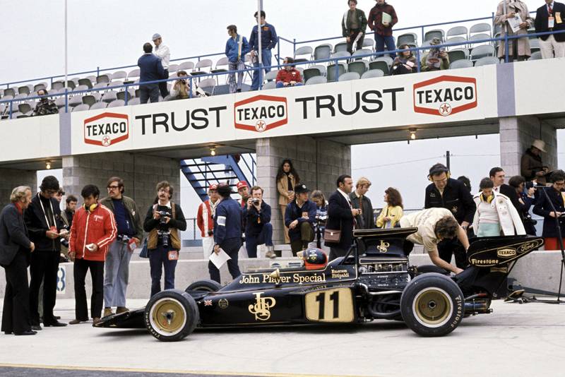 Emerson Fittipaldi sits in his Lotus in the pitlane at the 1972 United States Grand Prix, Watkins Glen.