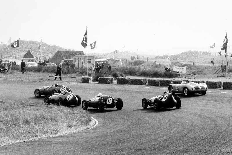 Cliff Allison in a Ferrari Dino 246, leads Jean Behra in his Ferrari Dino 246, Stirling Moss in a Cooper T51-Climax, Graham Hill in his Lotus 16-Climax, and Carel Godin de Beaufort in the Porsche RSK.