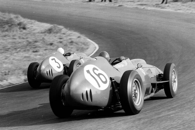 Phil Hill leads Cliff Allison, both driving Ferrari Dino 246's.