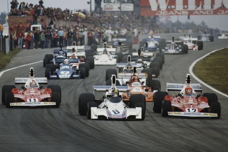 The field crowds into Turn One at the start of the 1975 Belgian Grand Prix, Zolder.