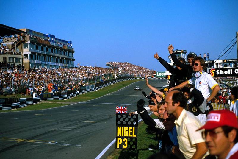 The Lotus team celebrate Nigel Mansell's 3rd place.