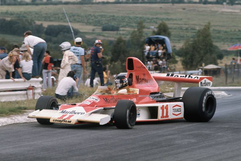 James Hunt (McLaren) dealing with oversteer at the South African Grand Prix, Kyalami.