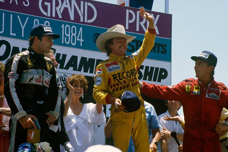 Keke Rosberg, 1st position, Elio de Angelis, 2nd position and Rene Arnoux, 3rd position on the podium.
