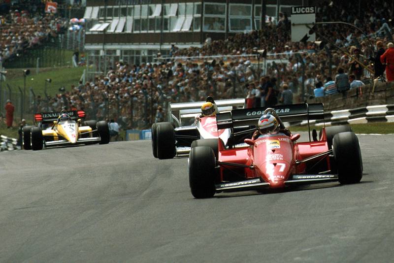 Michele Alboreto (Ferrari 126C4) leads Ayrton Senna (Toleman TG184).