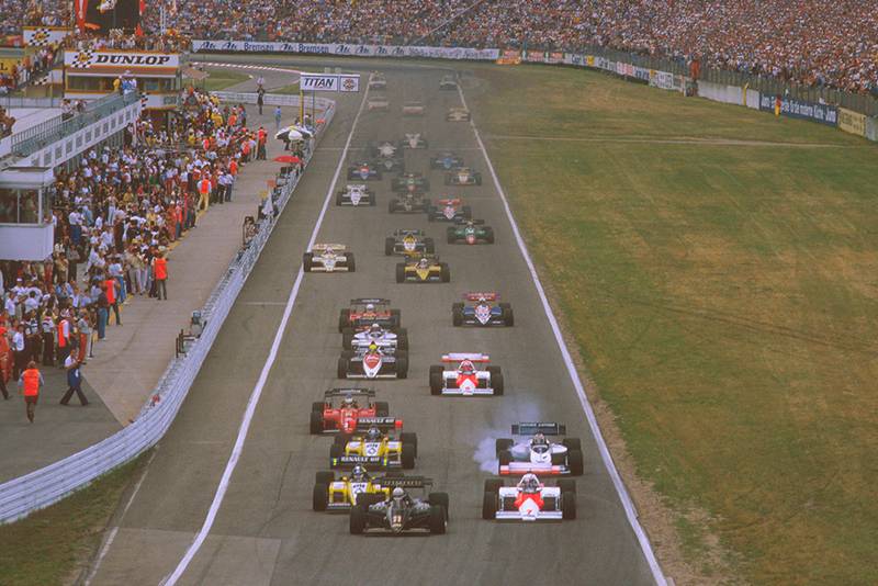 Manfred Winkelhock in his ATS leads a mid field group.