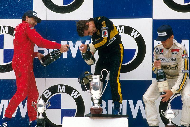 Ayrton Senna 1st position, Michele Alboreto 2nd position and Patrick Tambay 3rd position on the podium.