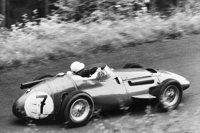 Stirling Moss on his way to second place in his Maserati 250F, 1956 German Grand Prix, Nurburgring.