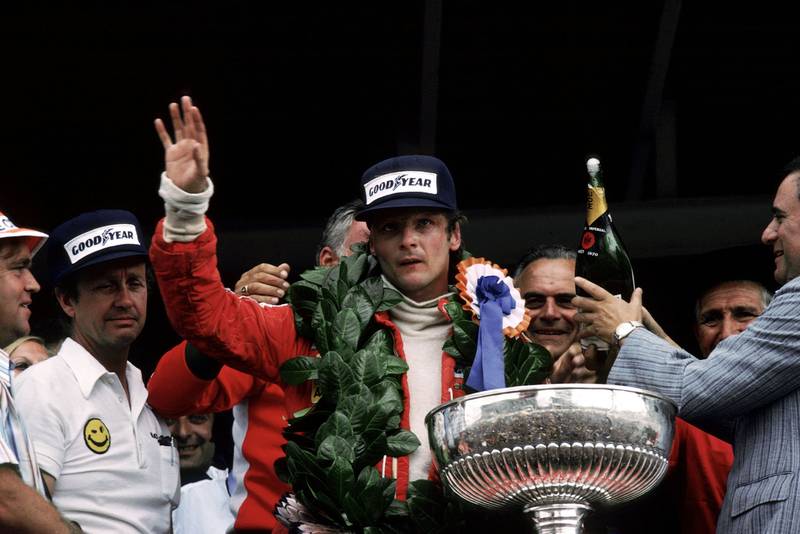 Niki Lauda (Ferrari) waves to the crowd after winning the 1977 South African Grand Prix.