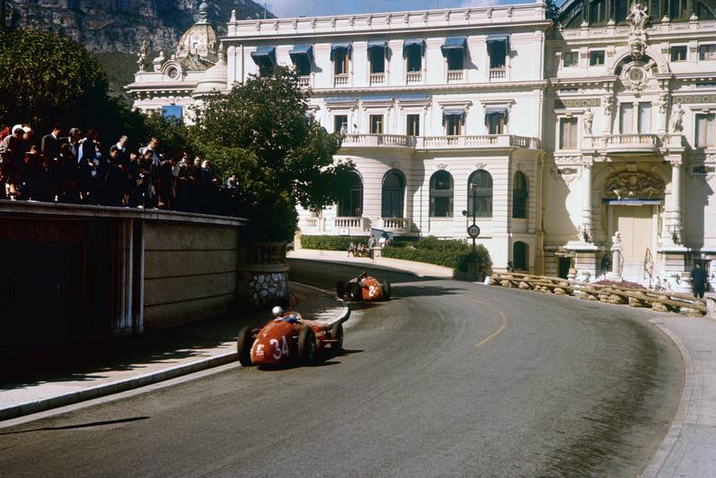 Masten Gregory leads Giorgio Scarlatti (both Maserati 250F) heading towards the casino, 1957 Monaco Grand Prix.