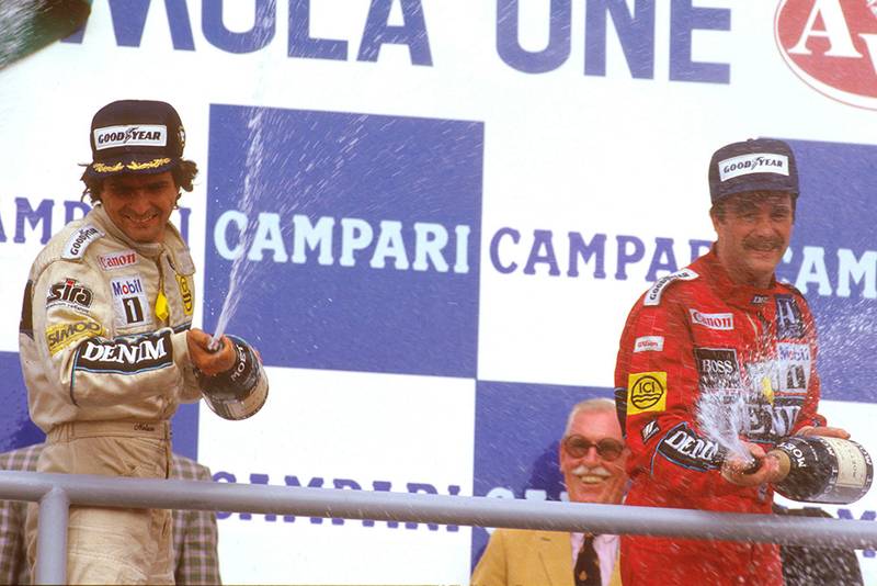 Nelson Piquet, 1st position with teammate Nigel Mansell, 3rd, on the podium.