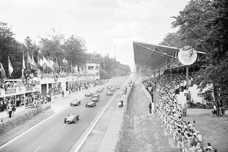 Jean Behra, Maserati 250F, leads Luigi Musso, Ferrari D50 (#10), Juan Manuel Fangio, Maserati 250F (#2), and Peter Collins, Ferrari D50 (#12), at the start of the 1957 French Grand Prix.