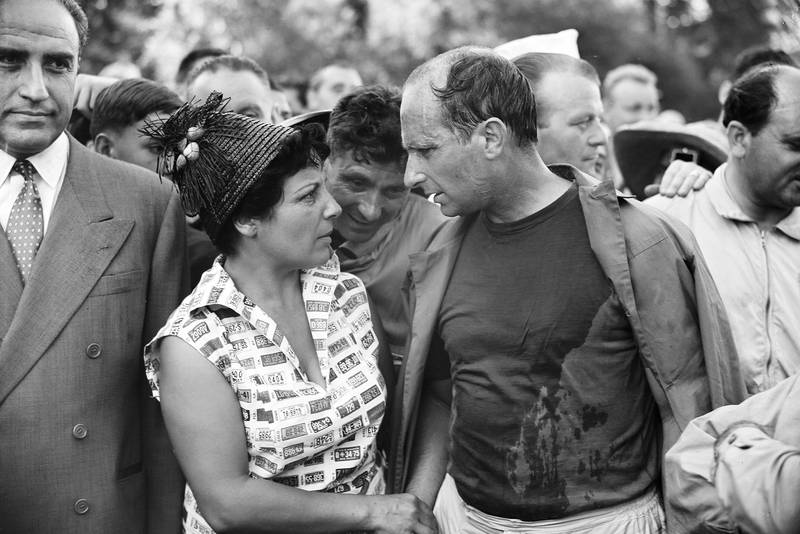 Juan Manuel Fangio celebrates his win at the 1957 French Grand Prix, Rouen