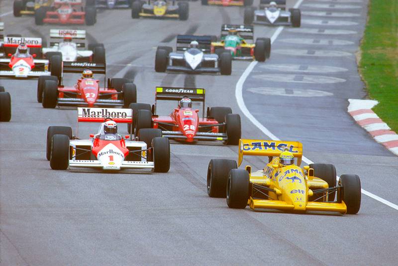 Ayrton Senna (Lotus 99T Honda) leads Alain Prost (McLaren MP4/3 TAG Porsche) and Gerhard Berger (Ferrari 187) at the start.