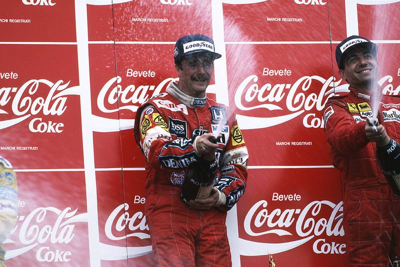 Race winner Nigel Mansell sprays the Champagne with third placed Michele Alboreto.