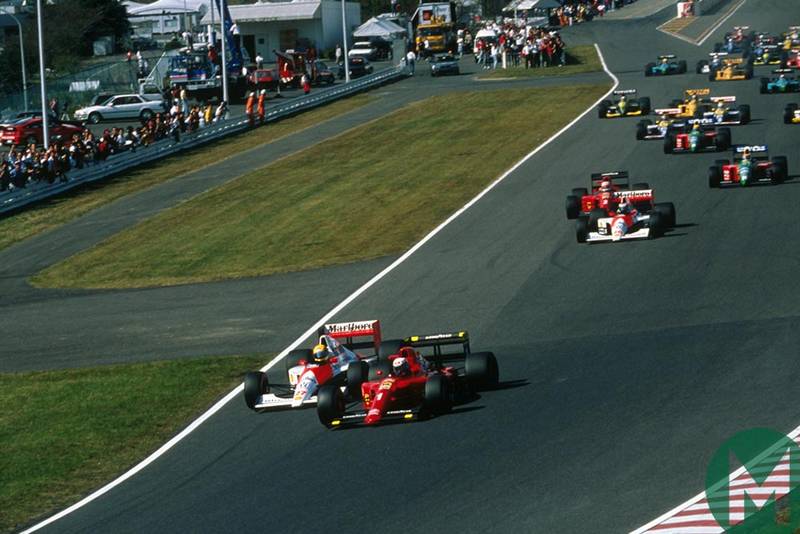 Ayrton Senna and Alain Prost head into the first corner at the 1990 Japanese Grand Prix