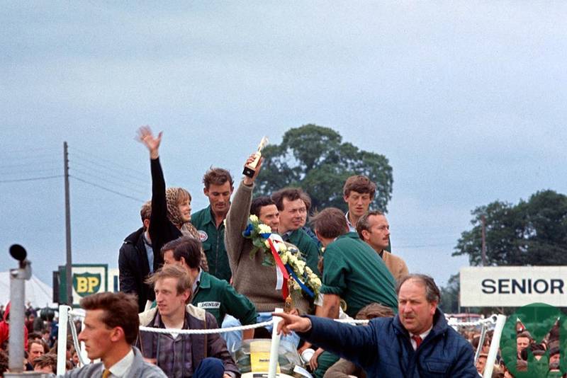 Jim Clark and Sally Swart on podium at 1963 British Grand Prix Silverstone