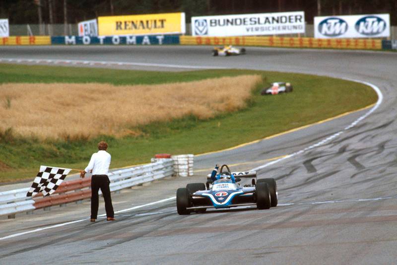 Jacques Laffite in his takes the chequered flag Ligier JS17 Matra for the win.