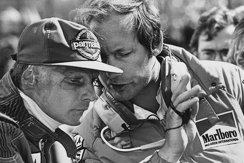 Lauda talks with team boss Ron Dennis.