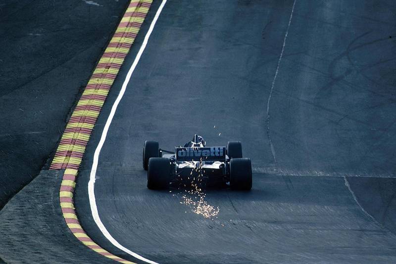 The Brabham BT54 sparks through Paddock Hill.