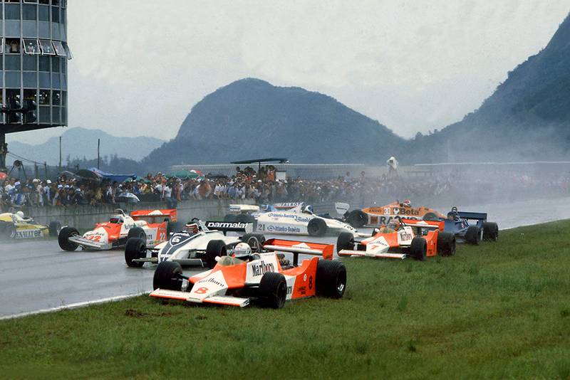 Chaos at the start with Andrea de Cesaris (#8 McLaren M29F-Ford Cosworth), Hector Rebaque (#6 Brabham BT49C-Ford Cosworth), Mario Andretti (#22 Alfa Romeo 179C), Rene Arnoux (#16 Renault RE20), John Watson (#7 McLaren M29F-Ford Cosworth), Chico Serra (#21 Fittipaldi F8C-Ford Cosworth), Ricardo Zunino (Tyrrell 010-Ford Cosworth), Siegfried Stohr (#30 Arrows A3-Ford Cosworth) and Jean-Pierre Jarier (Ligier JS17-Matra) are all involved in an accident on the grid.